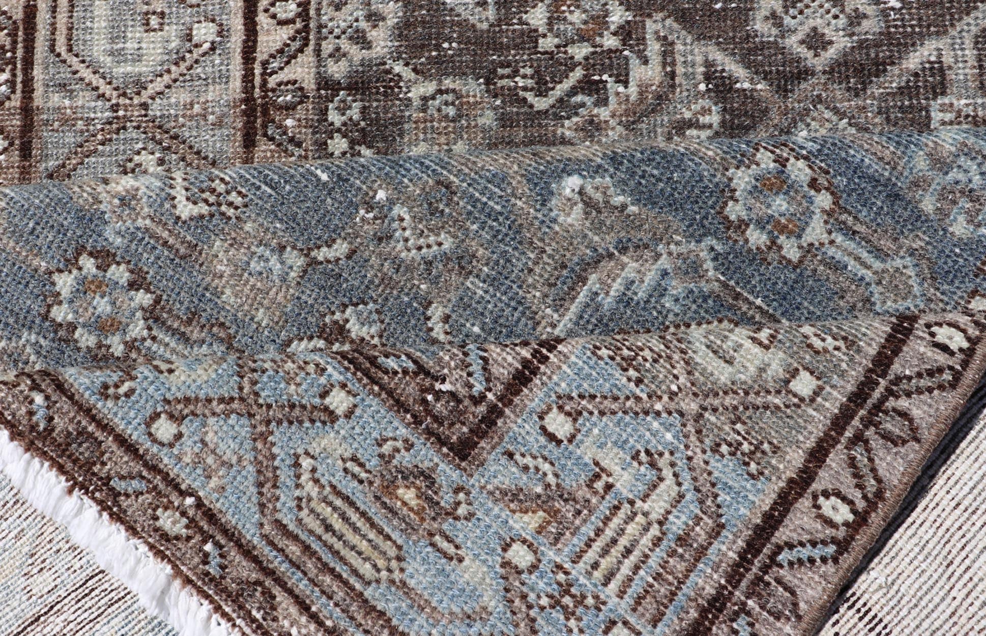 Antique Hand - Knotted Persian Hamadan Runner in Wool with All - Over Floral Design This antique Persian Hamadan rug has been hand - knotted in wool and features an all - over sub - geometric design rendered in multicolor. A complementary, multi - tiered b... - Keivan Woven ArtsPTA - 21011 - 18096