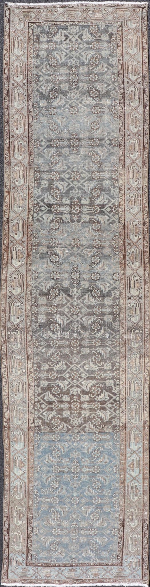 Antique Hand - Knotted Persian Hamadan Runner in Wool with All - Over Floral Design This antique Persian Hamadan rug has been hand - knotted in wool and features an all - over sub - geometric design rendered in multicolor. A complementary, multi - tiered b... - Keivan Woven ArtsPTA - 21011 - 18096