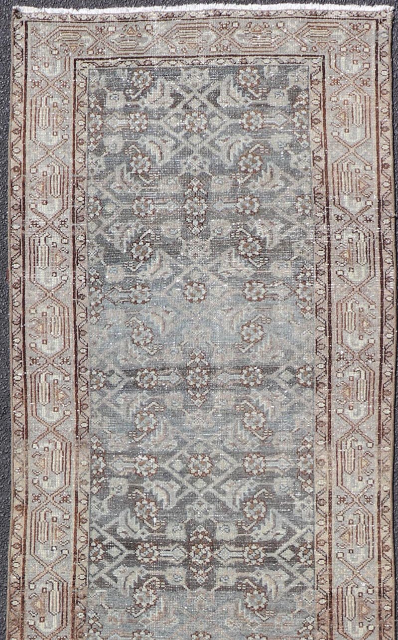 Antique Hand - Knotted Persian Hamadan Runner in Wool with All - Over Floral Design This antique Persian Hamadan rug has been hand - knotted in wool and features an all - over sub - geometric design rendered in multicolor. A complementary, multi - tiered b... - Keivan Woven ArtsPTA - 21011 - 18096