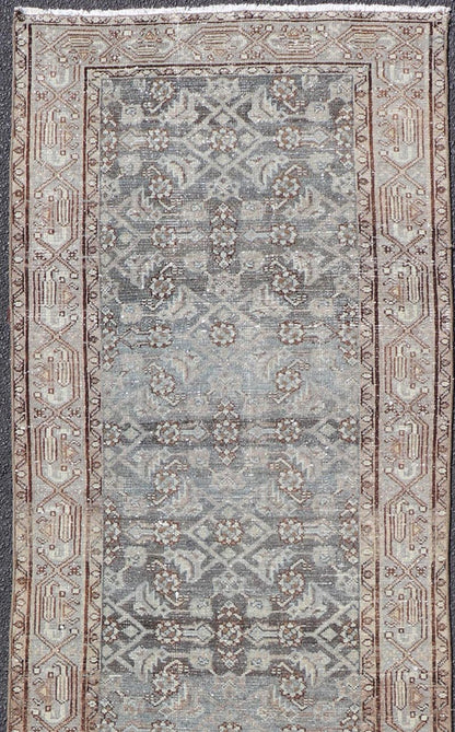 Antique Hand - Knotted Persian Hamadan Runner in Wool with All - Over Floral Design This antique Persian Hamadan rug has been hand - knotted in wool and features an all - over sub - geometric design rendered in multicolor. A complementary, multi - tiered b... - Keivan Woven ArtsPTA - 21011 - 18096