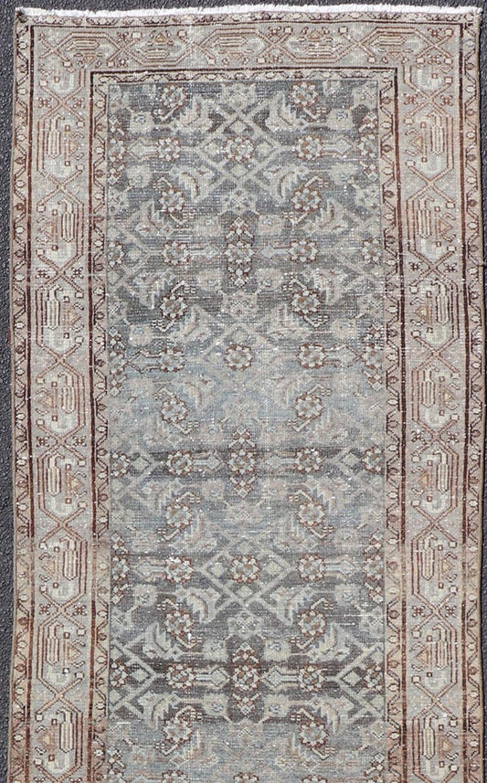 Antique Hand - Knotted Persian Hamadan Runner in Wool with All - Over Floral Design This antique Persian Hamadan rug has been hand - knotted in wool and features an all - over sub - geometric design rendered in multicolor. A complementary, multi - tiered b... - Keivan Woven ArtsPTA - 21011 - 18096