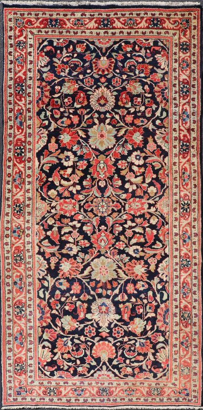 Antique Persian Gallery Runner with Floral Design in D. Blue & Jewel Tones. This lovely antique Gallery Mahal features a stunning all - over floral design set upon a dark blue background, and rendered in Ivory, Coral, varieties of Reds, Greens an... - Keivan Woven ArtsPTA - 21019 - 17376