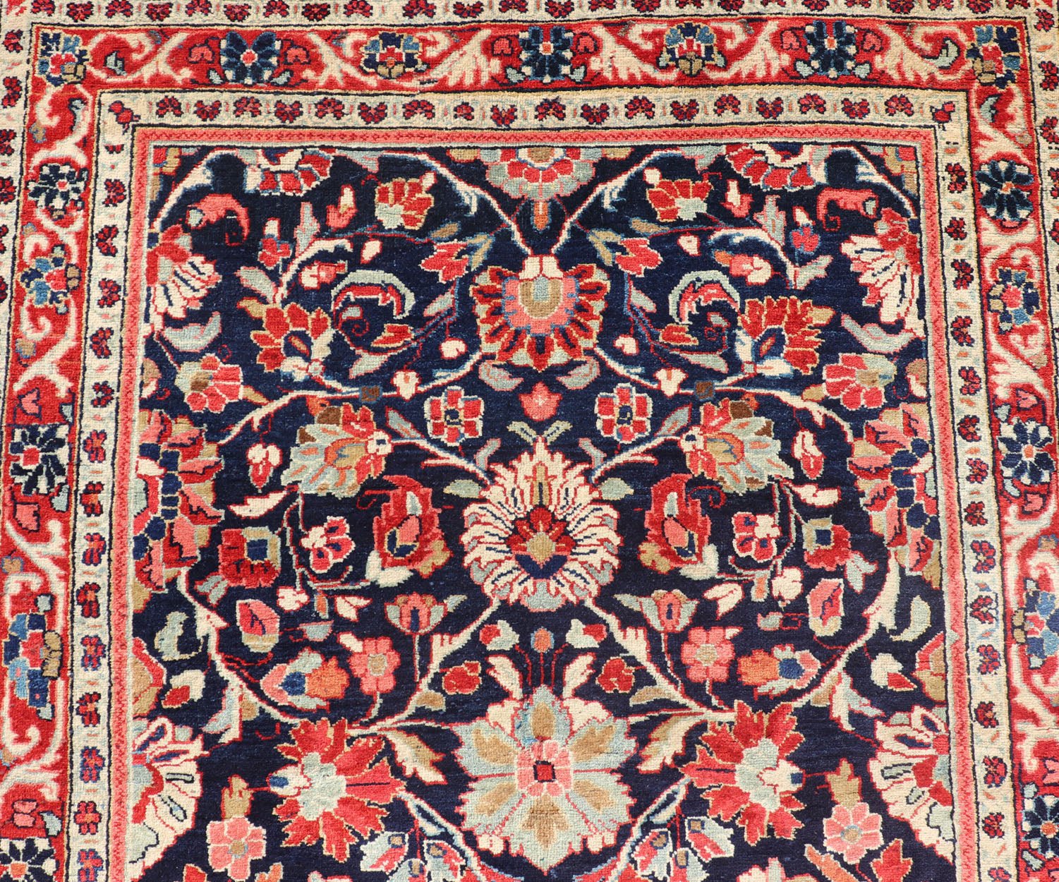 Antique Persian Gallery Runner with Floral Design in D. Blue & Jewel Tones. This lovely antique Gallery Mahal features a stunning all - over floral design set upon a dark blue background, and rendered in Ivory, Coral, varieties of Reds, Greens an... - Keivan Woven ArtsPTA - 21019 - 17376Rug