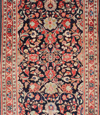 Antique Persian Gallery Runner with Floral Design in D. Blue & Jewel Tones. This lovely antique Gallery Mahal features a stunning all - over floral design set upon a dark blue background, and rendered in Ivory, Coral, varieties of Reds, Greens an... - Keivan Woven ArtsPTA - 21019 - 17376