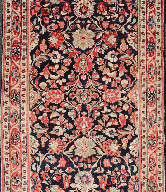 Antique Persian Gallery Runner with Floral Design in D. Blue & Jewel Tones. This lovely antique Gallery Mahal features a stunning all - over floral design set upon a dark blue background, and rendered in Ivory, Coral, varieties of Reds, Greens an... - Keivan Woven ArtsPTA - 21019 - 17376Rug