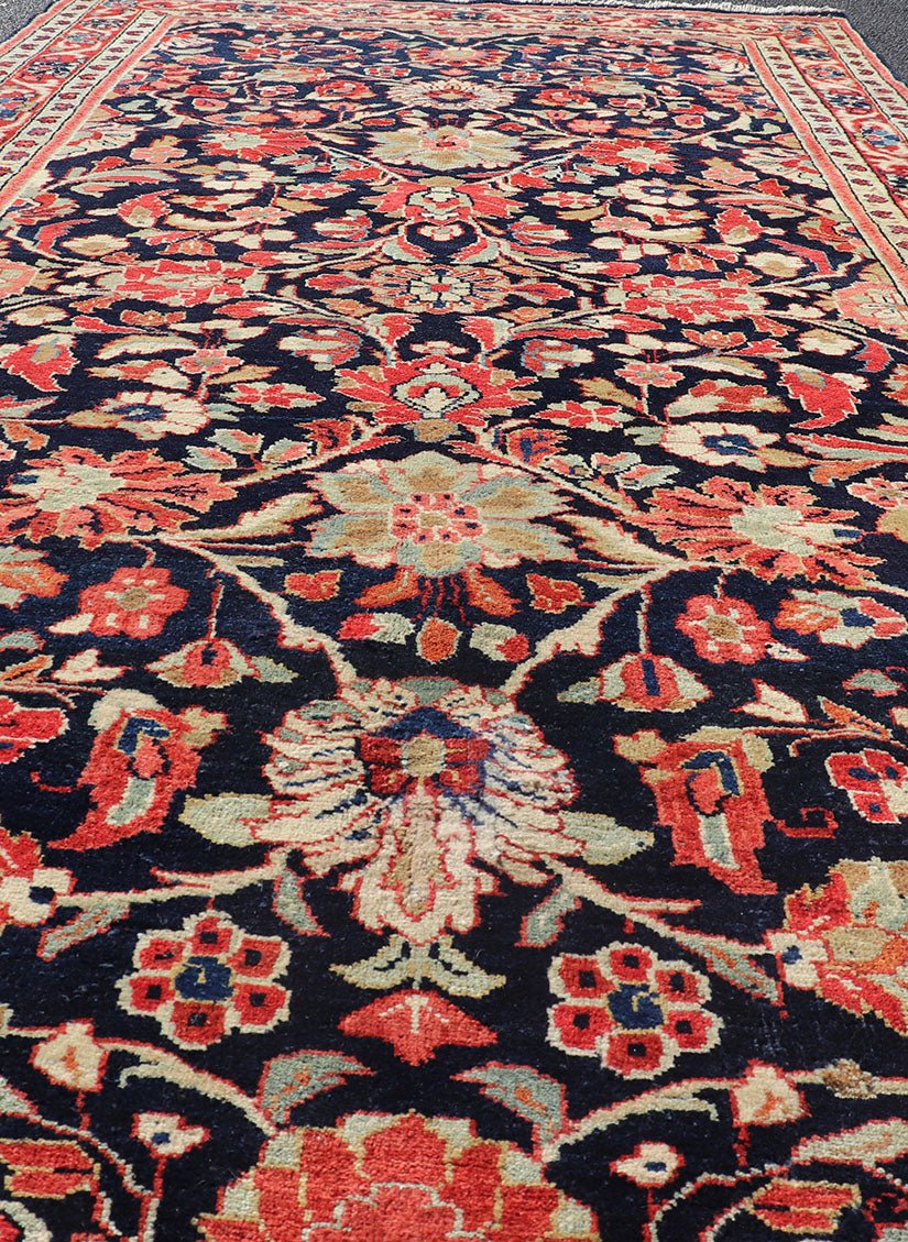 Antique Persian Gallery Runner with Floral Design in D. Blue & Jewel Tones. This lovely antique Gallery Mahal features a stunning all - over floral design set upon a dark blue background, and rendered in Ivory, Coral, varieties of Reds, Greens an... - Keivan Woven ArtsPTA - 21019 - 17376