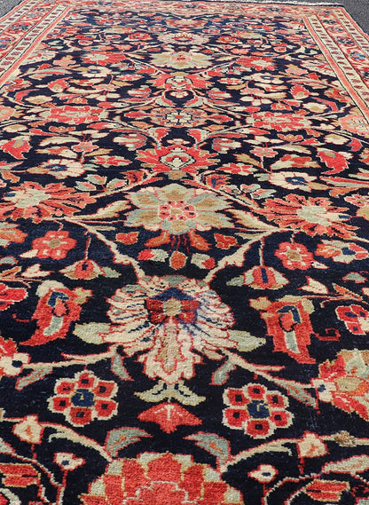 Antique Persian Gallery Runner with Floral Design in D. Blue & Jewel Tones. This lovely antique Gallery Mahal features a stunning all - over floral design set upon a dark blue background, and rendered in Ivory, Coral, varieties of Reds, Greens an... - Keivan Woven ArtsPTA - 21019 - 17376