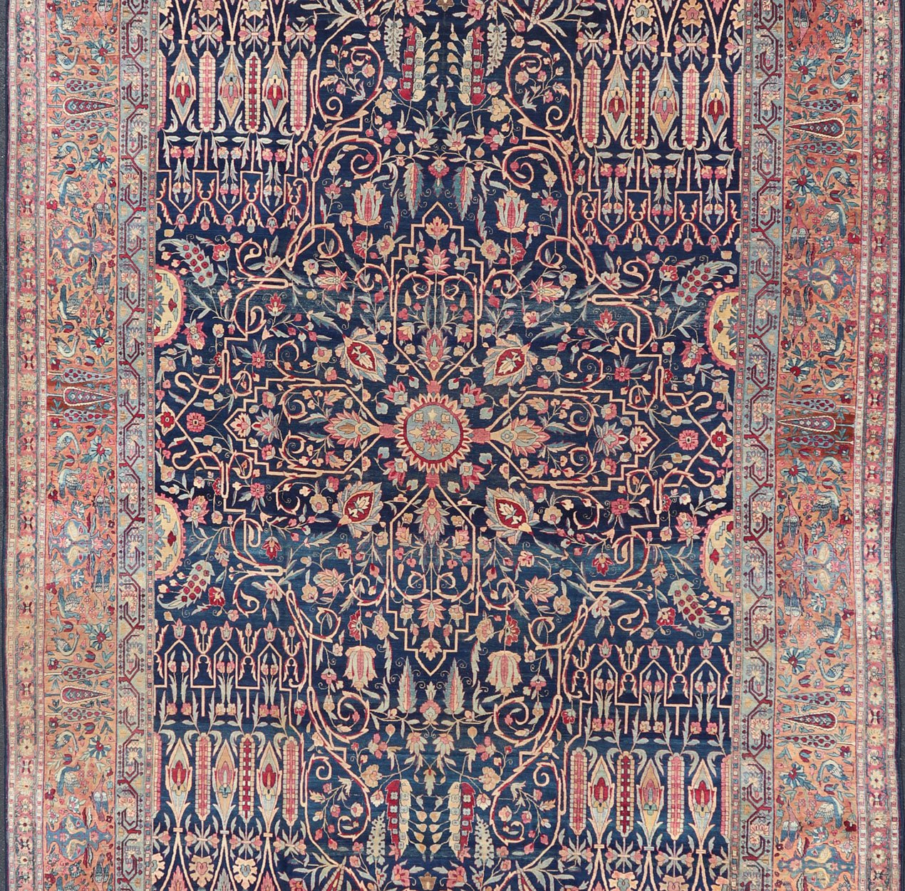 Antique Lavar Kerman Persian Rug with All - Over Floral Design on A Blue Field Measures: 11'7 x 19'2 This magnificent antique Lavar Kerman rug features an exquisite all - over floral design, enclosed within a complementary multi - tiered borde... - Keivan Woven ArtsPTA - 2109 - 11 - 17298