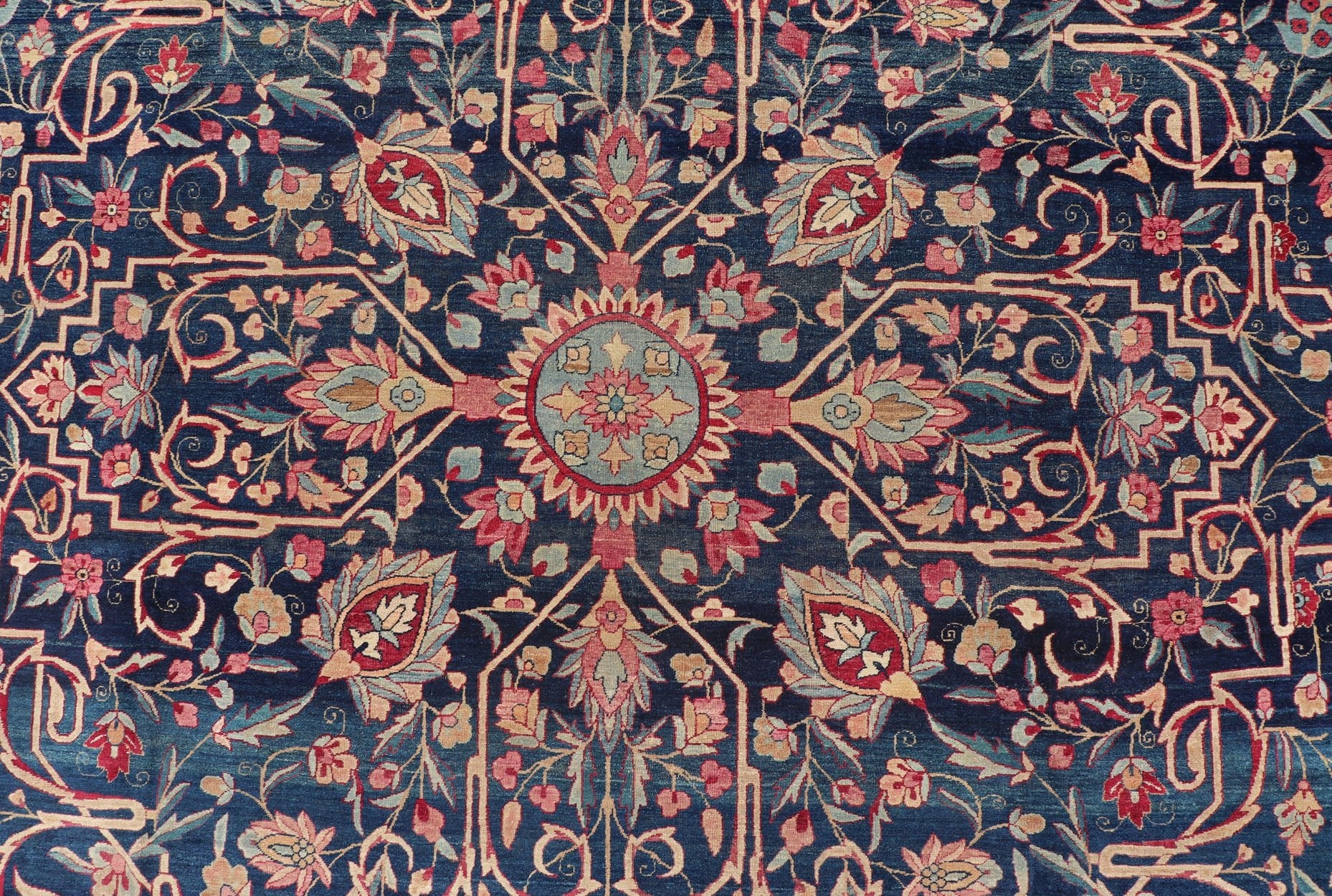 Antique Lavar Kerman Persian Rug with All - Over Floral Design on A Blue Field Measures: 11'7 x 19'2 This magnificent antique Lavar Kerman rug features an exquisite all - over floral design, enclosed within a complementary multi - tiered borde... - Keivan Woven ArtsPTA - 2109 - 11 - 17298
