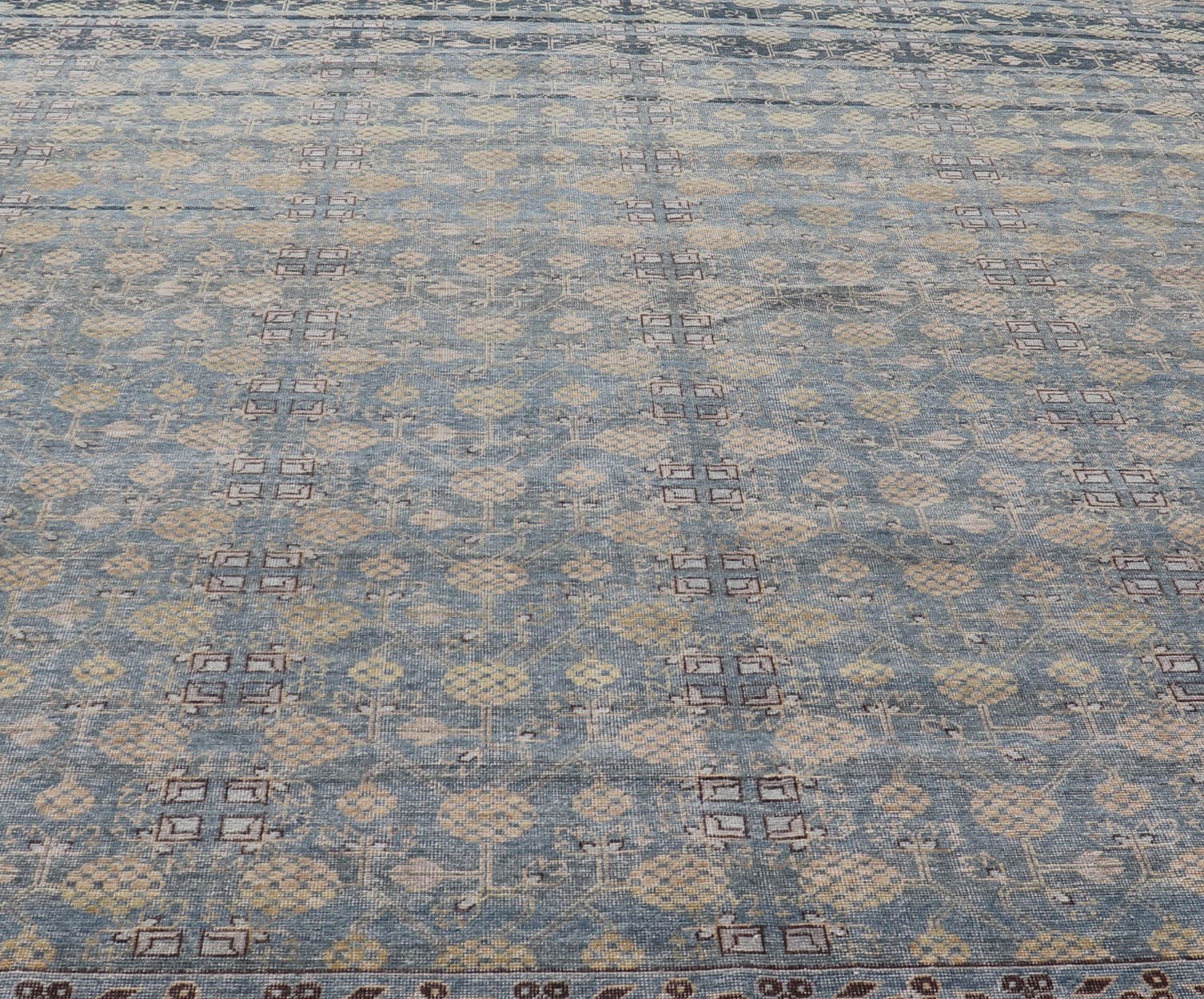 Modern All - Over Tribal Motif Khotan Area Rug in Dark Blues, Brown and Cream. Country of Origin: Afghanistan; Type: Khotan; Design: Floral, All - Over; Keivan Woven Arts: rug/PUR - 42561. Measures: 12'1 x 15'1 This modern Khotan features a modern da... - Keivan Woven ArtsPUR - 42561 - GS - 1016 - 22620Rug