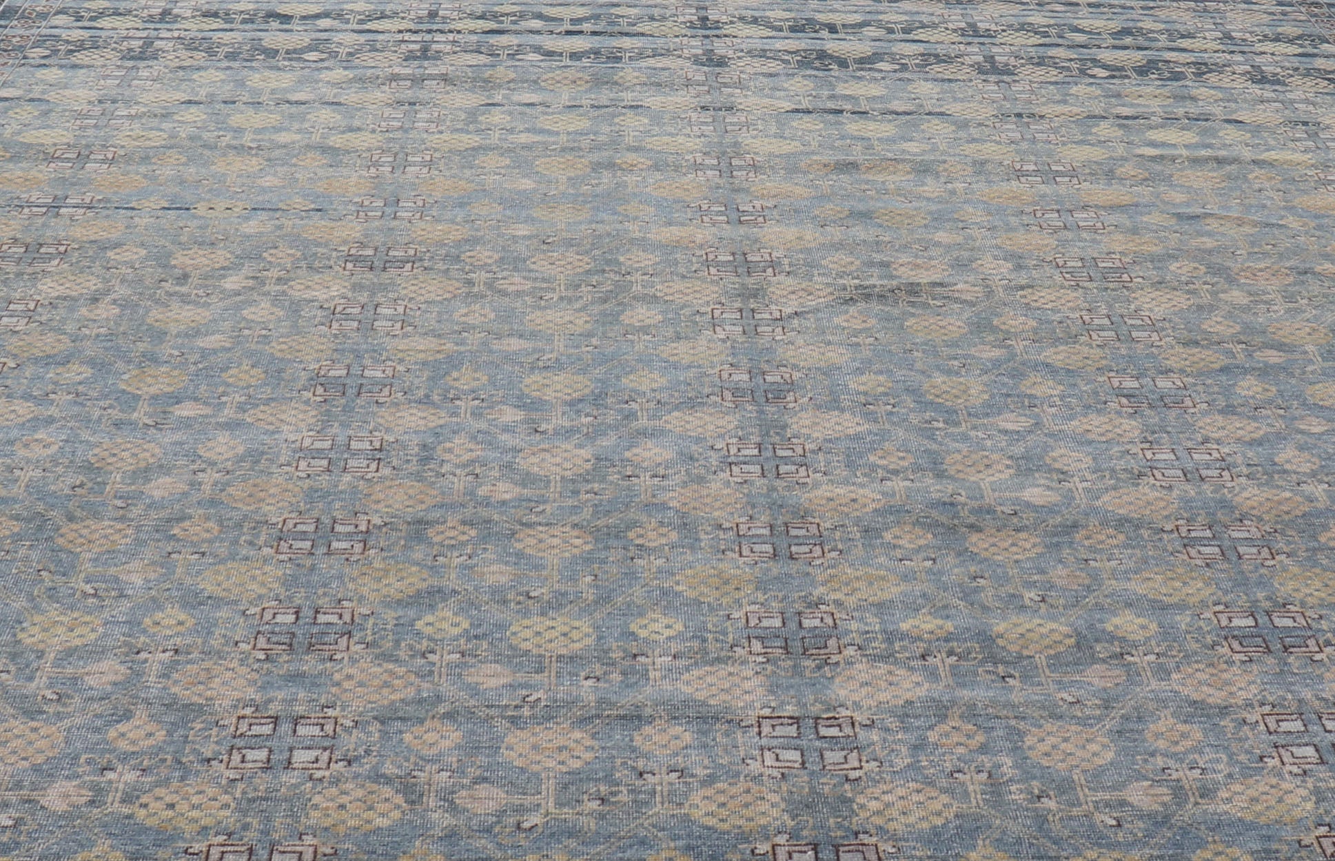 Modern All - Over Tribal Motif Khotan Area Rug in Dark Blues, Brown and Cream. Country of Origin: Afghanistan; Type: Khotan; Design: Floral, All - Over; Keivan Woven Arts: rug/PUR - 42561. Measures: 12'1 x 15'1 This modern Khotan features a modern da... - Keivan Woven ArtsPUR - 42561 - GS - 1016 - 22620Rug