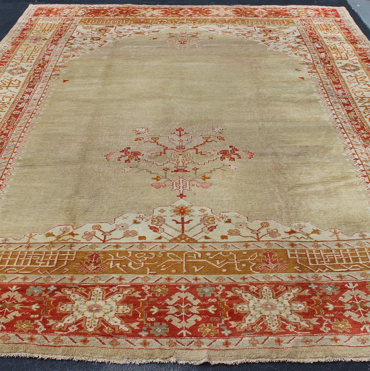 Large Antique Oushak Rug in Taupe/Light Green Background and Red Border Measures: 11'6 x 16. Taupe and sea - foam field patterned with a flawlessly floral motif frames one end of the carpet, which bears vase of flowers and floral motifs an... - Keivan Woven ArtsR20 - 0302 - 12825Rug