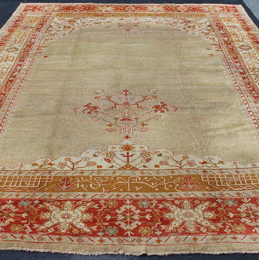 Large Antique Oushak Rug in Taupe/Light Green Background and Red Border Measures: 11'6 x 16. Taupe and sea - foam field patterned with a flawlessly floral motif frames one end of the carpet, which bears vase of flowers and floral motifs an... - Keivan Woven ArtsR20 - 0302 - 12825Rug