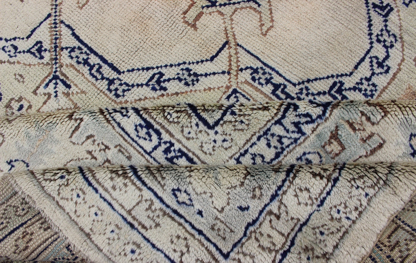 Antique Turkish Oushak with Geometric Motifs in Champagne Field and Accent Blue, Oushak antique rug from Turkey. Keivan Woven Arts / rug R20 - 0303, country of origin / type: Turkey / Oushak, circa 1920 This beautiful rug from early 20th century T... - Keivan Woven ArtsR20 - 0303 - 12831Rug
