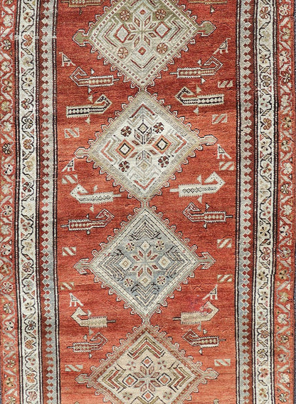Antique Kurdish Runner with Rusty Red Background and Medallions Tribal Motifs All - over Medallion antique Persian Kurdish runner in soft red - rust, rug R20 - 0705, country of origin / type: Iran / Kurdish, circa 1910 This Kurdish tribal rug w... - Keivan Woven ArtsR20 - 0705 - 12968Rug