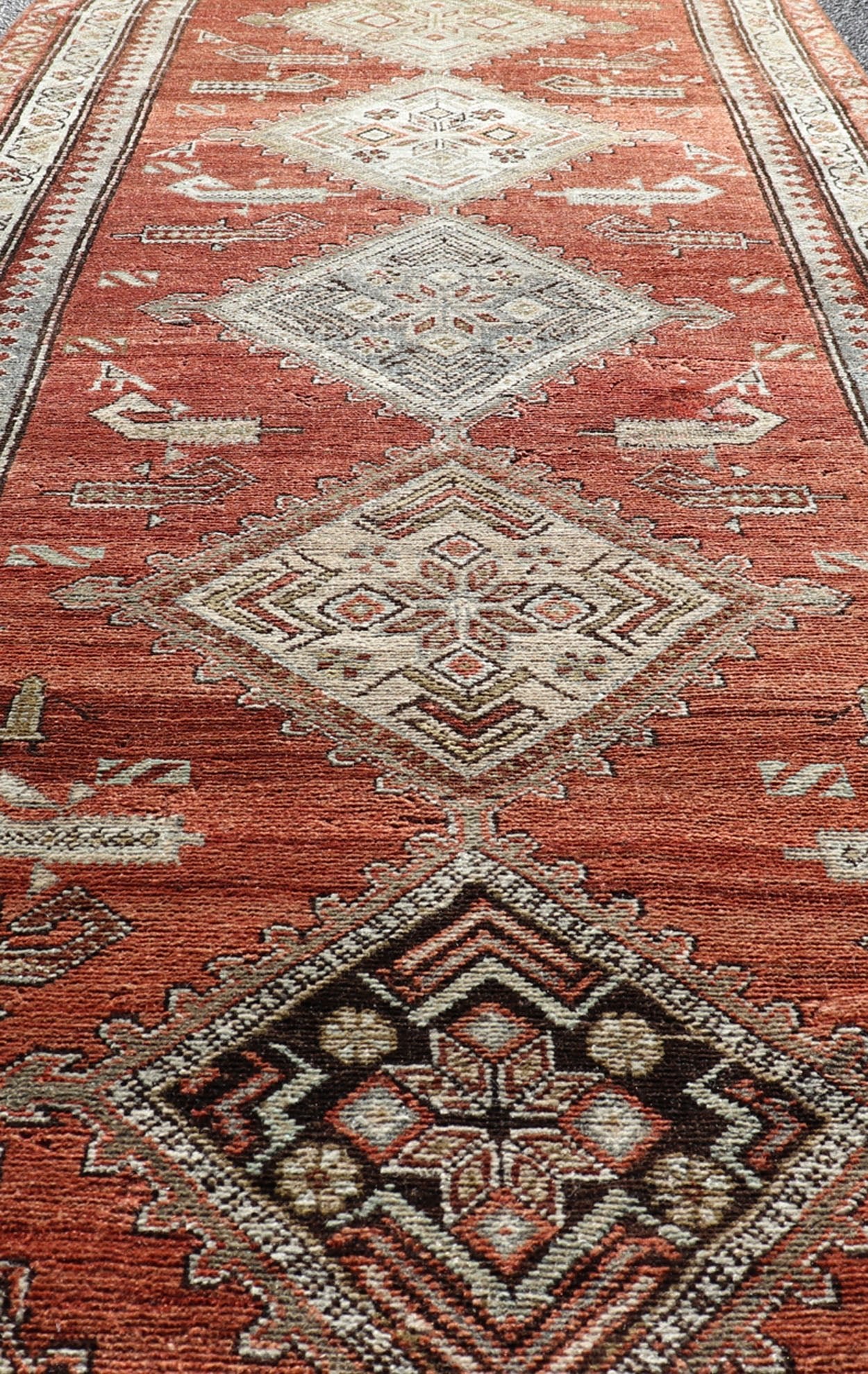 Antique Kurdish Runner with Rusty Red Background and Medallions Tribal Motifs All - over Medallion antique Persian Kurdish runner in soft red - rust, rug R20 - 0705, country of origin / type: Iran / Kurdish, circa 1910 This Kurdish tribal rug w... - Keivan Woven ArtsR20 - 0705 - 12968Rug