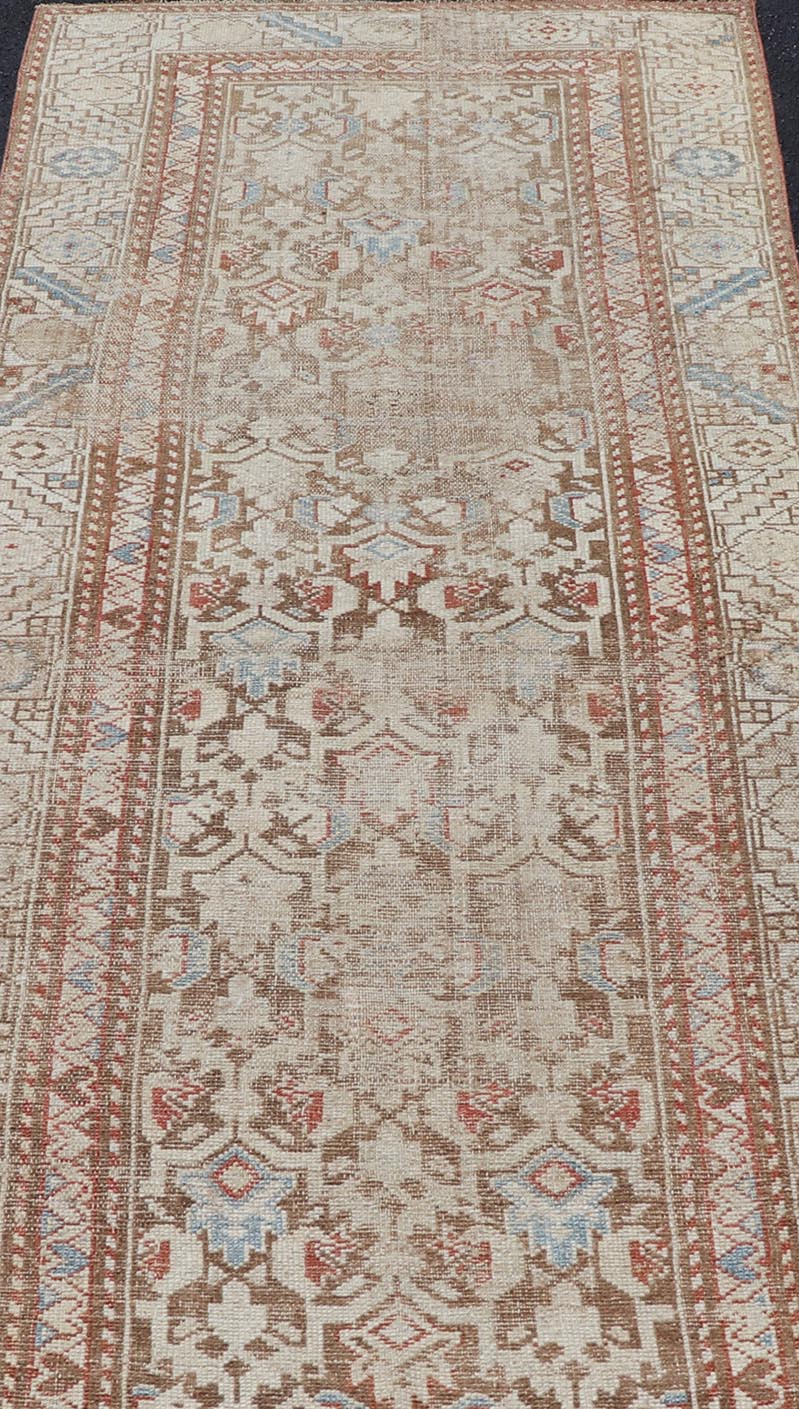 Antique Kurdish Runner in Soft Tones in Wool with All - Over Tribal Design Keivan Woven Arts / rug/R20 - 0708, country of origin / type: Iran / Kurdish, circa 1900. Measures: 3'0 x 8'1 This antique Persian Kurdish runner has been hand - knotted in ... - Keivan Woven ArtsR20 - 0708 - 12988Rug