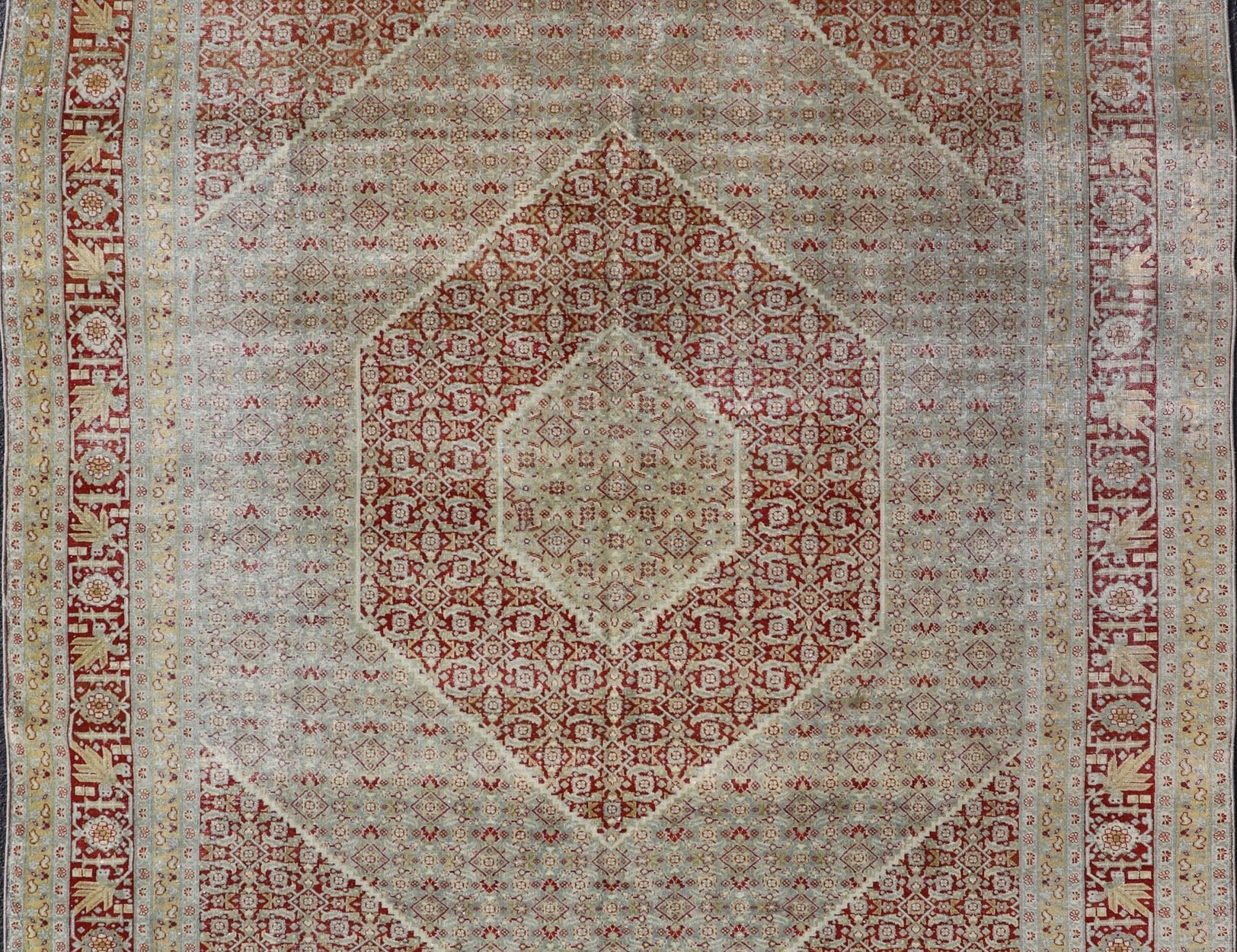 Antique Persian Tabriz Distressed Carpet With Geometric Diamond Design Beautiful red, soft green, tan, light blue, gray, yellow Geometric Persian Tabriz rug, rug R20 - 0722, country of origin / type: Iran / Tabriz, circa 1920. This antique Tabr... - Keivan Woven ArtsR20 - 0722 - 12960