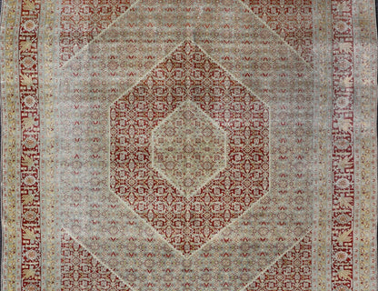 Antique Persian Tabriz Distressed Carpet With Geometric Diamond Design Beautiful red, soft green, tan, light blue, gray, yellow Geometric Persian Tabriz rug, rug R20 - 0722, country of origin / type: Iran / Tabriz, circa 1920. This antique Tabr... - Keivan Woven ArtsR20 - 0722 - 12960