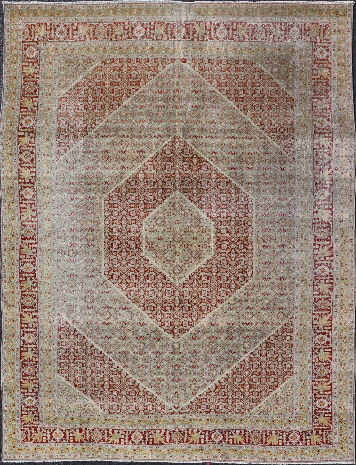 Antique Persian Tabriz Distressed Carpet With Geometric Diamond Design Beautiful red, soft green, tan, light blue, gray, yellow Geometric Persian Tabriz rug, rug R20 - 0722, country of origin / type: Iran / Tabriz, circa 1920. This antique Tabr... - Keivan Woven ArtsR20 - 0722 - 12960