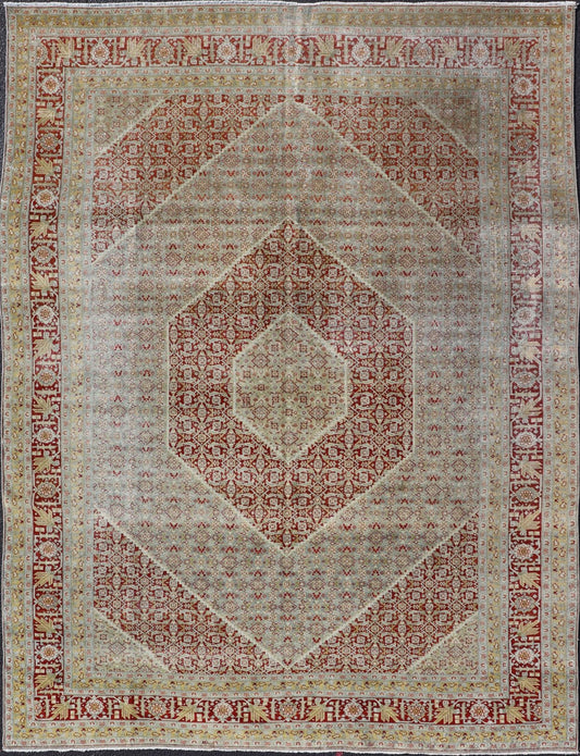 Antique Persian Tabriz Distressed Carpet With Geometric Diamond Design Beautiful red, soft green, tan, light blue, gray, yellow Geometric Persian Tabriz rug, rug R20 - 0722, country of origin / type: Iran / Tabriz, circa 1920. This antique Tabr... - Keivan Woven ArtsR20 - 0722 - 12960