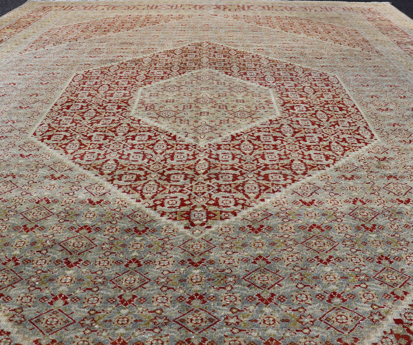 Antique Persian Tabriz Distressed Carpet With Geometric Diamond Design Beautiful red, soft green, tan, light blue, gray, yellow Geometric Persian Tabriz rug, rug R20 - 0722, country of origin / type: Iran / Tabriz, circa 1920. This antique Tabr... - Keivan Woven ArtsR20 - 0722 - 12960
