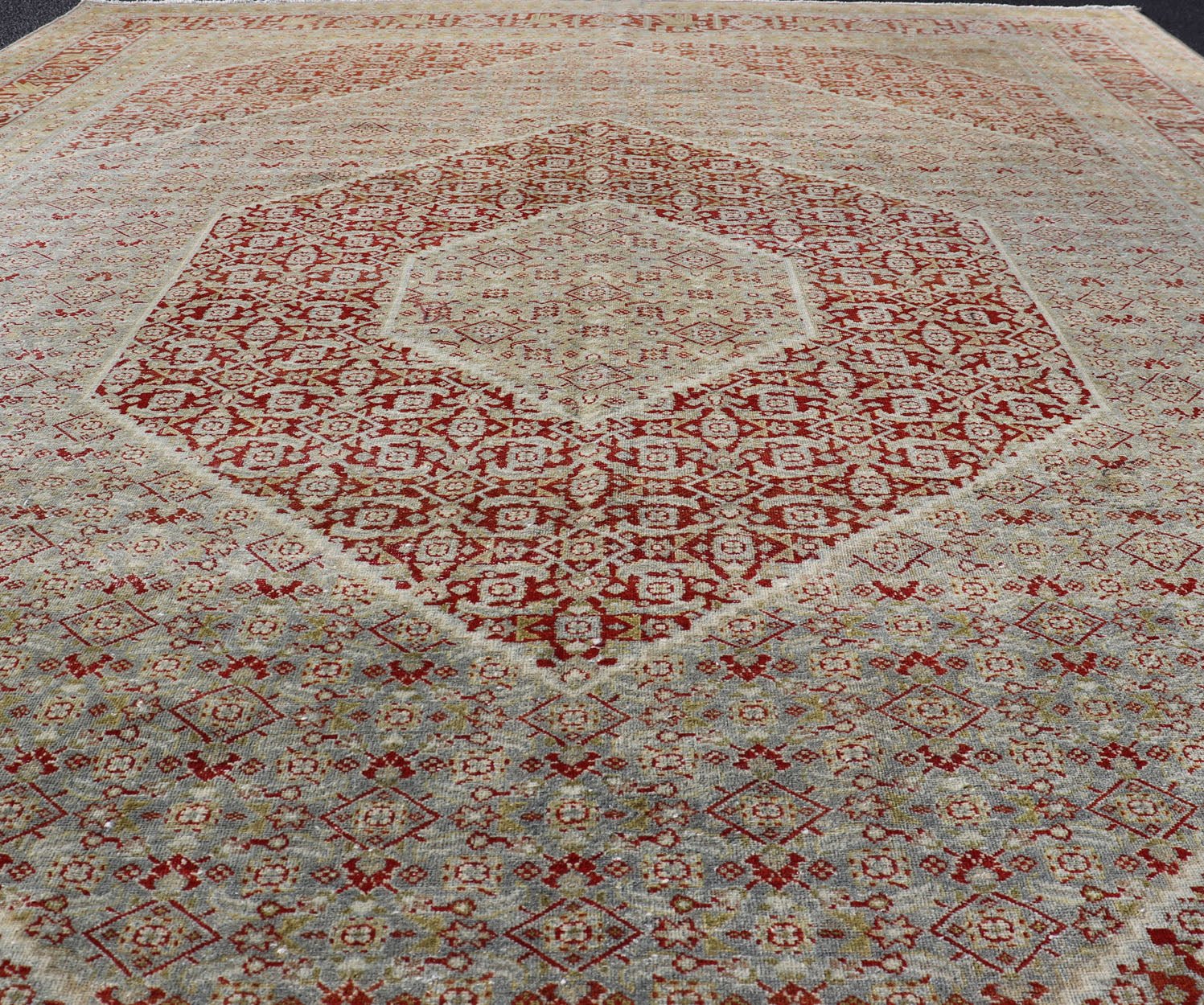 Antique Persian Tabriz Distressed Carpet With Geometric Diamond Design Beautiful red, soft green, tan, light blue, gray, yellow Geometric Persian Tabriz rug, rug R20 - 0722, country of origin / type: Iran / Tabriz, circa 1920. This antique Tabr... - Keivan Woven ArtsR20 - 0722 - 12960