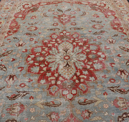 Measures: 11'2 x 17'2 Antique Persian Rug with Fine Weave Tabriz in Light Blue Background and Orange Finely woven antique Tabriz rug with circular, script - style medallion and blue field, Keivan Woven Arts / rug / R20 - 0804. Classic Persian r... - Keivan Woven ArtsR20 - 0804 - 13098Rug