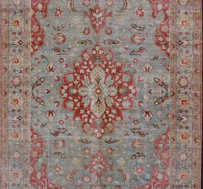 Measures: 11'2 x 17'2 Antique Persian Rug with Fine Weave Tabriz in Light Blue Background and Orange Finely woven antique Tabriz rug with circular, script - style medallion and blue field, Keivan Woven Arts / rug / R20 - 0804. Classic Persian r... - Keivan Woven ArtsR20 - 0804 - 13098Rug