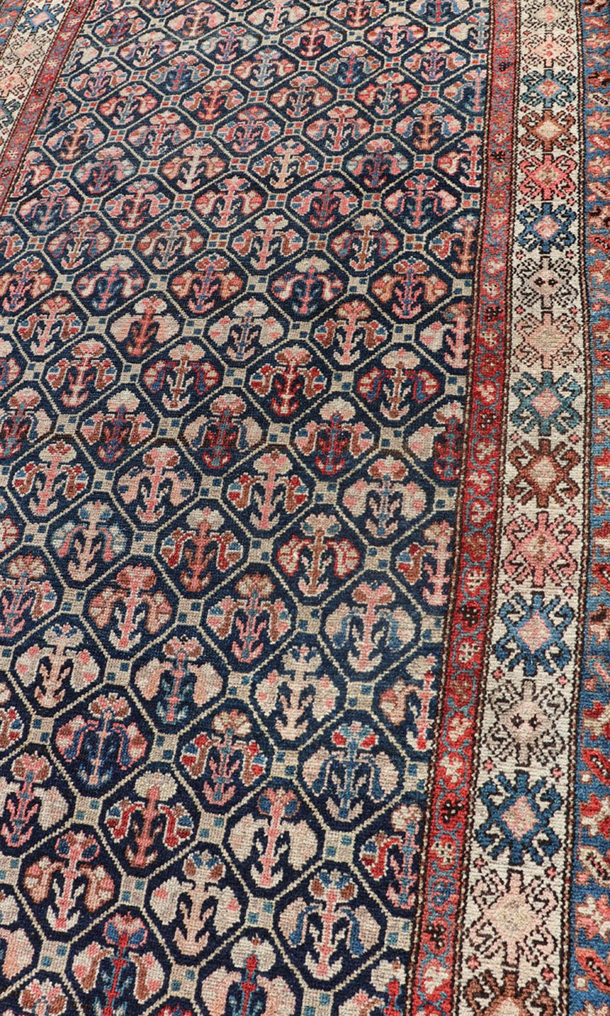 Tribal Persian Hamedan Rug in Blue, Red, Brown, and Ivory Tribal Persian Hamedan rug in midnight blue, red, cream. Keivan Woven Arts / rug R20 - 0838, country of origin / type: Iran / Hamedan, circa 1920 This Persian Hamedan features a uniq... - Keivan Woven ArtsR20 - 0838 - 13336Rug