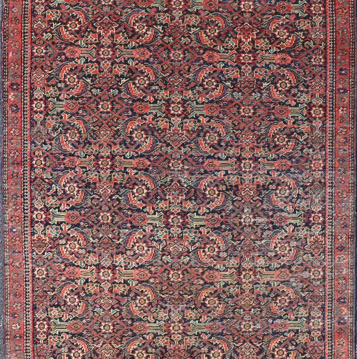 Antique Faraghan Fine Persian Rug in Navy Color Background And Jewel Tones. Keivan Woven Arts / Rug / R20 - 1003 / Type / Iran / Faraghan / Circa Early 20th Century. Measures: 2'10 x 5'6 This exquisite antique Faraghan fine Persian rug displays a ... - Keivan Woven ArtsR20 - 1003 - 14088Rug