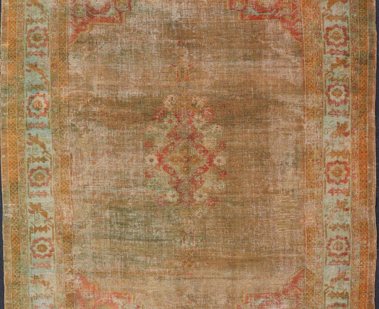 Antique Turkish Oushak Keivan Woven Arts With Medallion in Green, Coral, L. Blue & Marigold. Keivan Woven Arts / rug / R20 - 1015, country of origin / type: Turkey / Oushak, circa 1900 Measures: 8'10 x 12'4 This diverse and beautiful 1900'... - Keivan Woven ArtsR20 - 1015 - 14152Rug