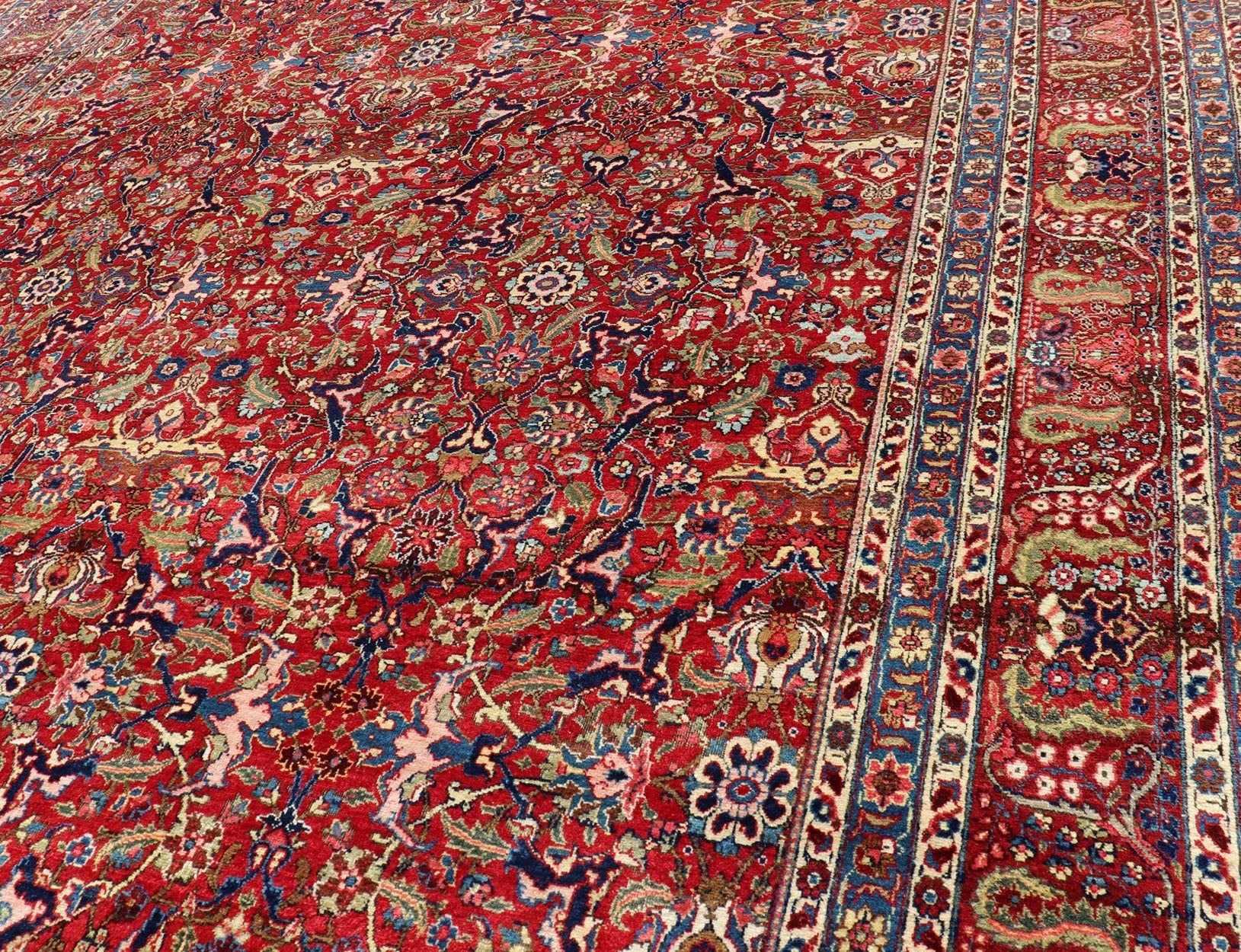 Keivan Woven Arts - Large Antique Persian Fine Weave Tabriz in Red Background & Light Blue Guard Borders. Finely woven antique Tabriz rug with all - over design field in Red Background & Light Blue Guard Borders and variety of colors in the entire ru... - Keivan Woven ArtsR20 - 1105 - 14162Rug