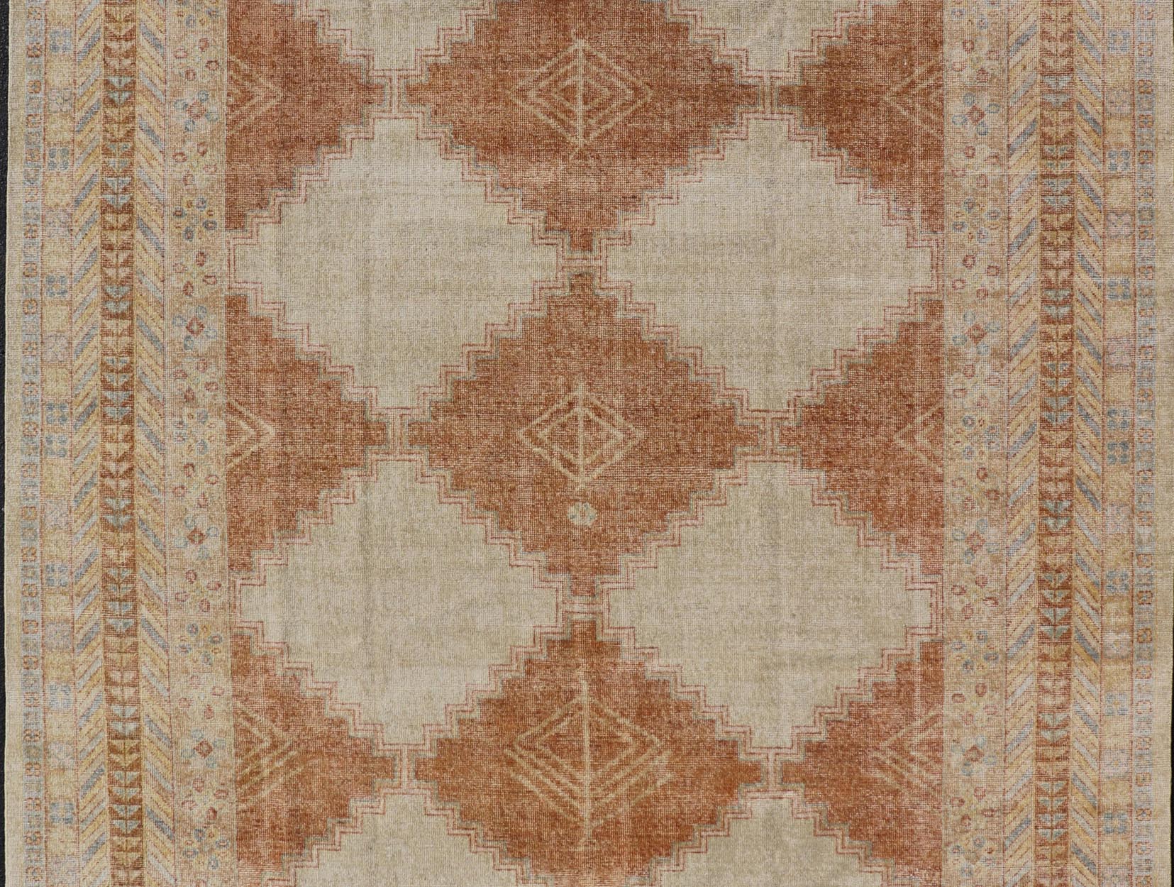 Distressed Modern Khotan Design Rug with Diamond & Geometric Pattern In Ivory, Burnt Orange, light green, light blue and yellow colors. Keivan Woven Arts/ rug RJK - 24848 - JPR - 011 - 01 country of origin / type: India / Khotan 21st Century. Measures: ... - Keivan Woven ArtsRJK - 24848 - JPR - 011 - 01 - 21535Rug