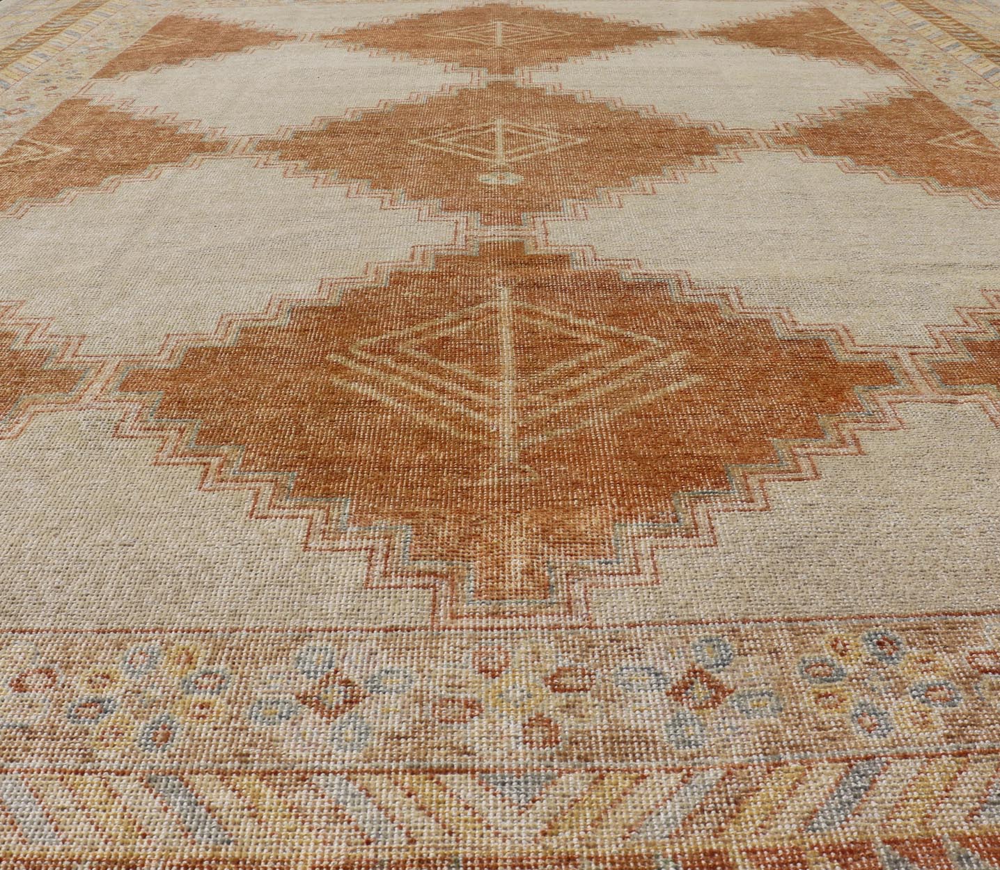 Distressed Modern Khotan Design Rug with Diamond & Geometric Pattern In Ivory, Burnt Orange, light green, light blue and yellow colors. Keivan Woven Arts/ rug RJK - 24848 - JPR - 011 - 01 country of origin / type: India / Khotan 21st Century. Measures: ... - Keivan Woven ArtsRJK - 24848 - JPR - 011 - 01 - 21535Rug