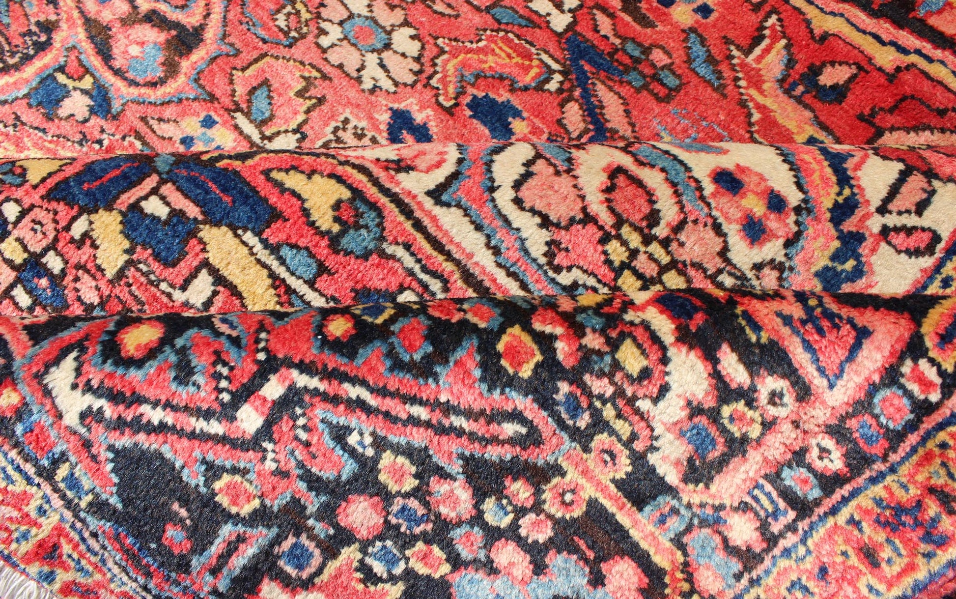 Large Semi antique Heriz with soft reds and multi - color midcentury Persian Heriz rug with stylized medallion design, rug rm - m17420, country of origin / type: Iran / Heriz, circa 1950. This magnificent antique Persian Heriz carpet from the mid - 20... - Keivan Woven ArtsRM - M17420 - 2163Rug