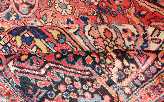 Large Semi antique Heriz with soft reds and multi - color midcentury Persian Heriz rug with stylized medallion design, rug rm - m17420, country of origin / type: Iran / Heriz, circa 1950. This magnificent antique Persian Heriz carpet from the mid - 20... - Keivan Woven ArtsRM - M17420 - 2163Rug