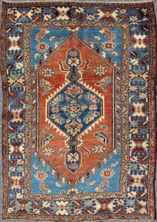 Antique Persian Karadjeh rug with tribal medallion in rust red and bright blue, rugs 12 - 0104, country of origin / type: Iran / Karadjeh, circa 1910. This early 20th century, handwoven antique Persian Karadjeh rug features a rust red - colored fiel... - Keivan Woven ArtsS12 - 0104 - 3223Rug