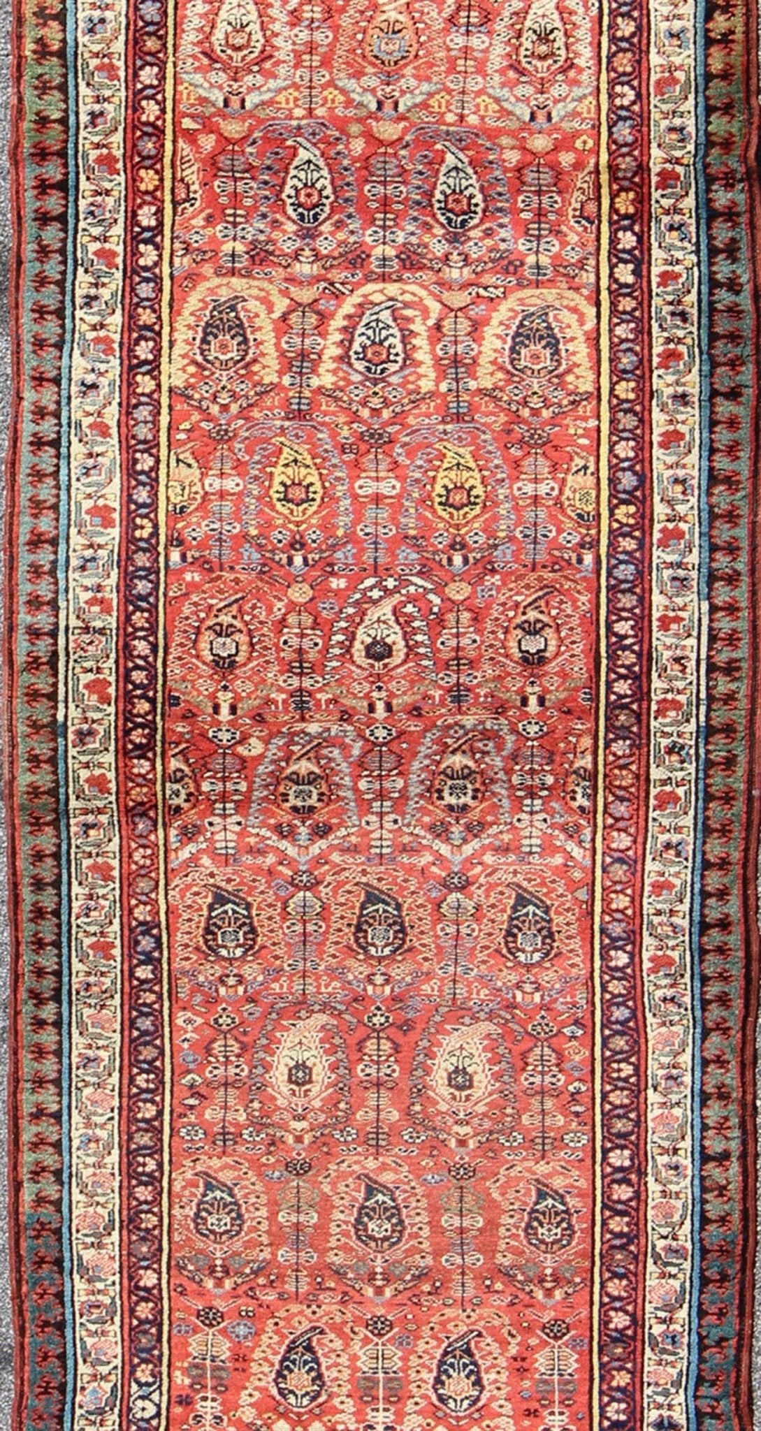 Antique Persian Serab Runner This all - over Persian Serab has a terra cotta background and an ivory border. The elegant design in the field consists of a free - flowing Paisley pattern. The blue, greens and yellows add a hint of color to this stunn... - Keivan Woven ArtsS12 - 0503 - 4090Rug