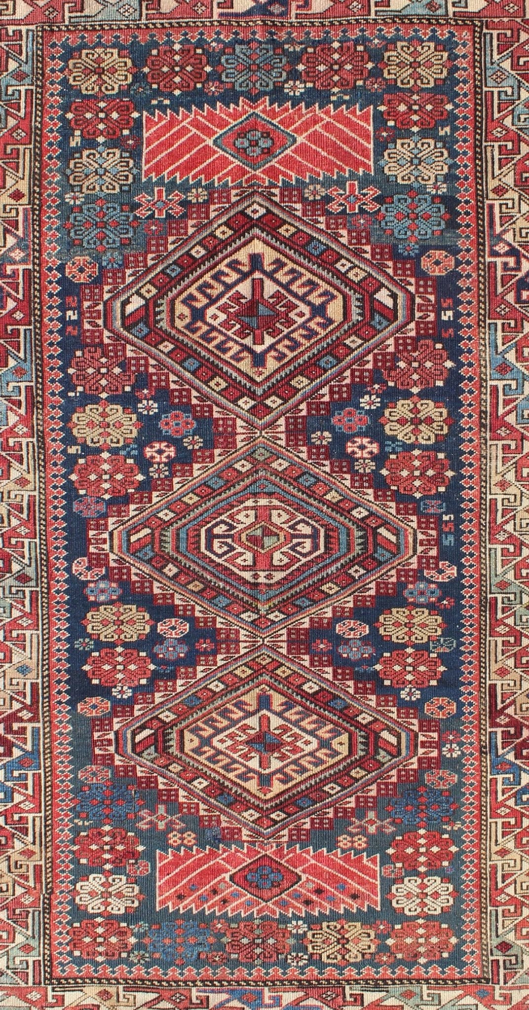 Antique Kazak Rug with In Multi Colors and Indigo Background. This antique, late 19th century Kazak rug from Russia displays three bold, geometric central medallions set on an indigo background and surrounded by multiple complementary geometric... - Keivan Woven ArtsS12 - 0517 - 3720Rug