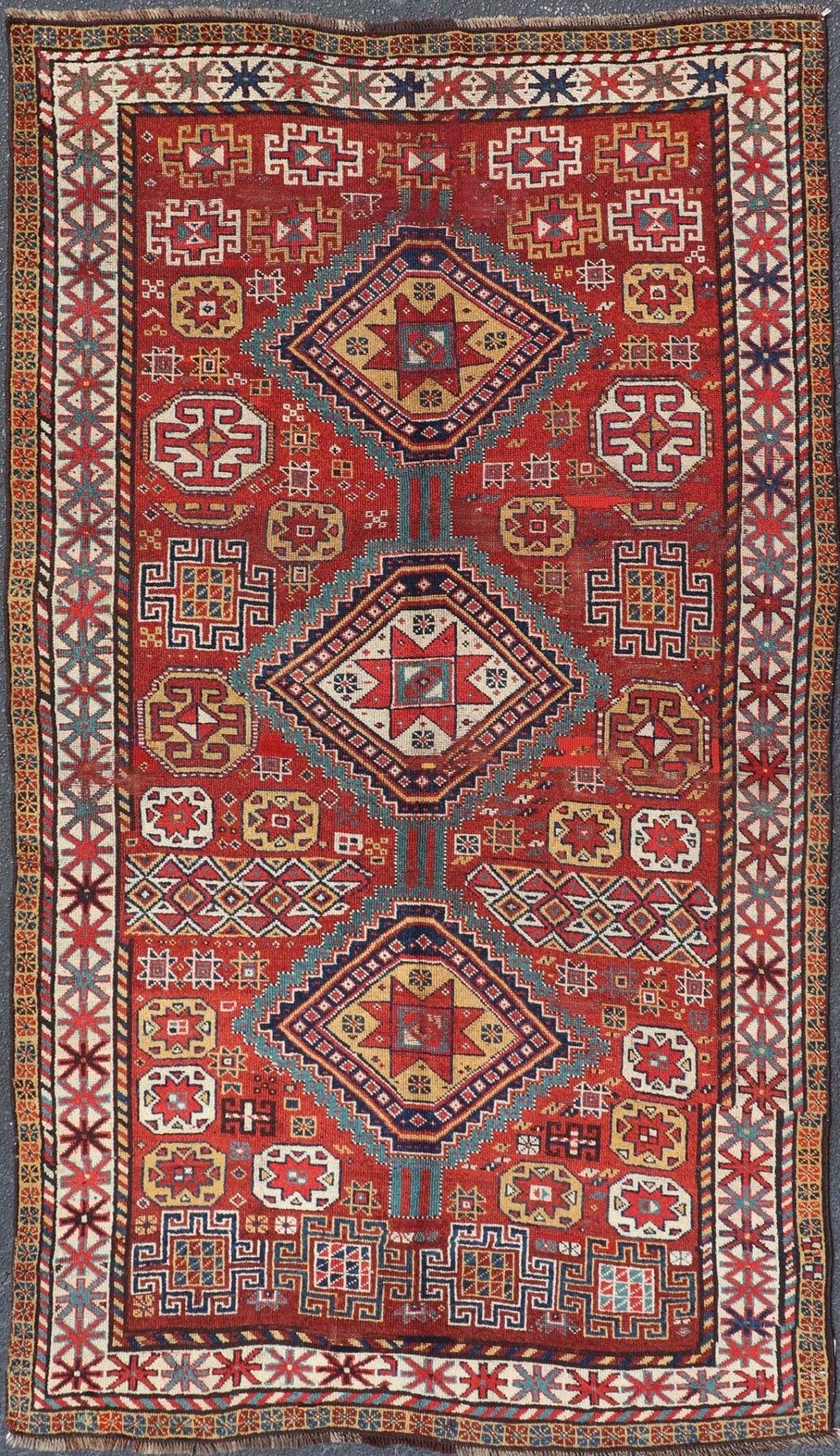 Antique Qashqai Rug with Geometric Motifs in Red, Blue, and Golden Yellow This stunning 19th century Qashqai rug from the central region of Persia displays three magnificent, geometric central medallions and an all - over geometric design. A dynam... - Keivan Woven ArtsS12 - 0518 - 3998Rug