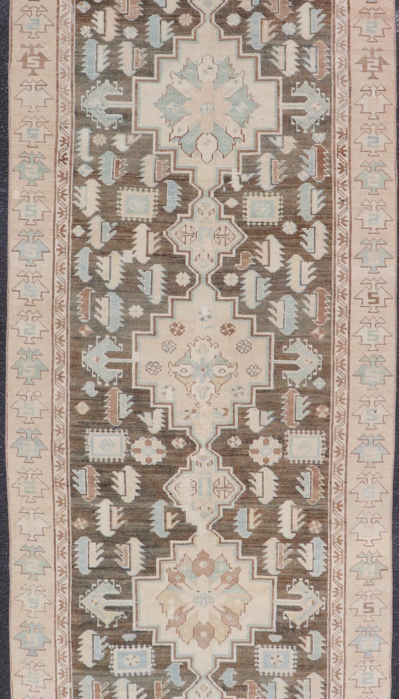 Antique Kazak Runner with Geometric Design And Medallions On A Brown Field Country of Origin: Caucasus Type: Kazak Design: medallion, Sub - Geometric, Early 20th century, Keivan Woven Arts; rug S12 - 0519 Measures: 3'2 x 8'7 This piece was h... - Keivan Woven ArtsS12 - 0519 - 3263Rug