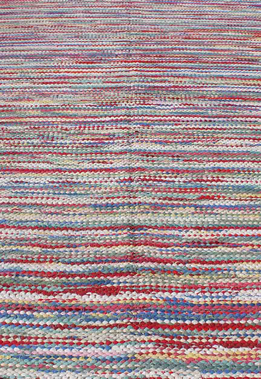 1970s Colorful Braided Rug American with Horizontal Stripes and Fringe Detail, rug s12 - 0809, country of origin / type: America / braided, circa 1960 This large vintage American braided rug (circa 1960) features a vibrant color palette coupled wi... - Keivan Woven ArtsS12 - 0809 - 3339Rug
