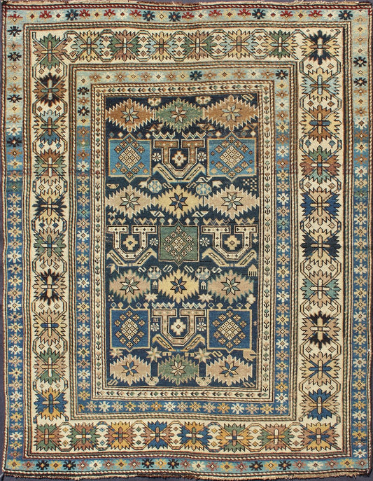 Antique Hand Knotted Caucasian Shirvan Rug in Blue with Tribal Design Measures: 3'3'' x 4'5''. The field of this Caucasian piece features all - over tribal motifs and shapes decorated with small flowers and square designs, alternating c... - Keivan Woven ArtsS12 - 0912 - 3670Rug