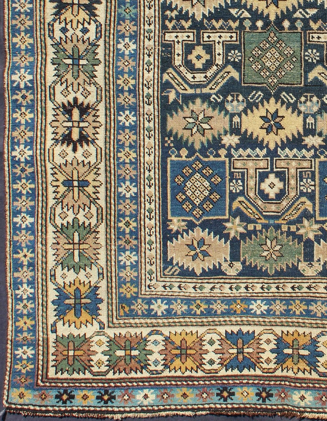 Antique Hand Knotted Caucasian Shirvan Rug in Blue with Tribal Design Measures: 3'3'' x 4'5''. The field of this Caucasian piece features all - over tribal motifs and shapes decorated with small flowers and square designs, alternating c... - Keivan Woven ArtsS12 - 0912 - 3670Rug