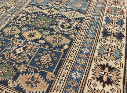Antique Hand Knotted Caucasian Shirvan Rug in Blue with Tribal Design Measures: 3'3'' x 4'5''. The field of this Caucasian piece features all - over tribal motifs and shapes decorated with small flowers and square designs, alternating c... - Keivan Woven ArtsS12 - 0912 - 3670Rug