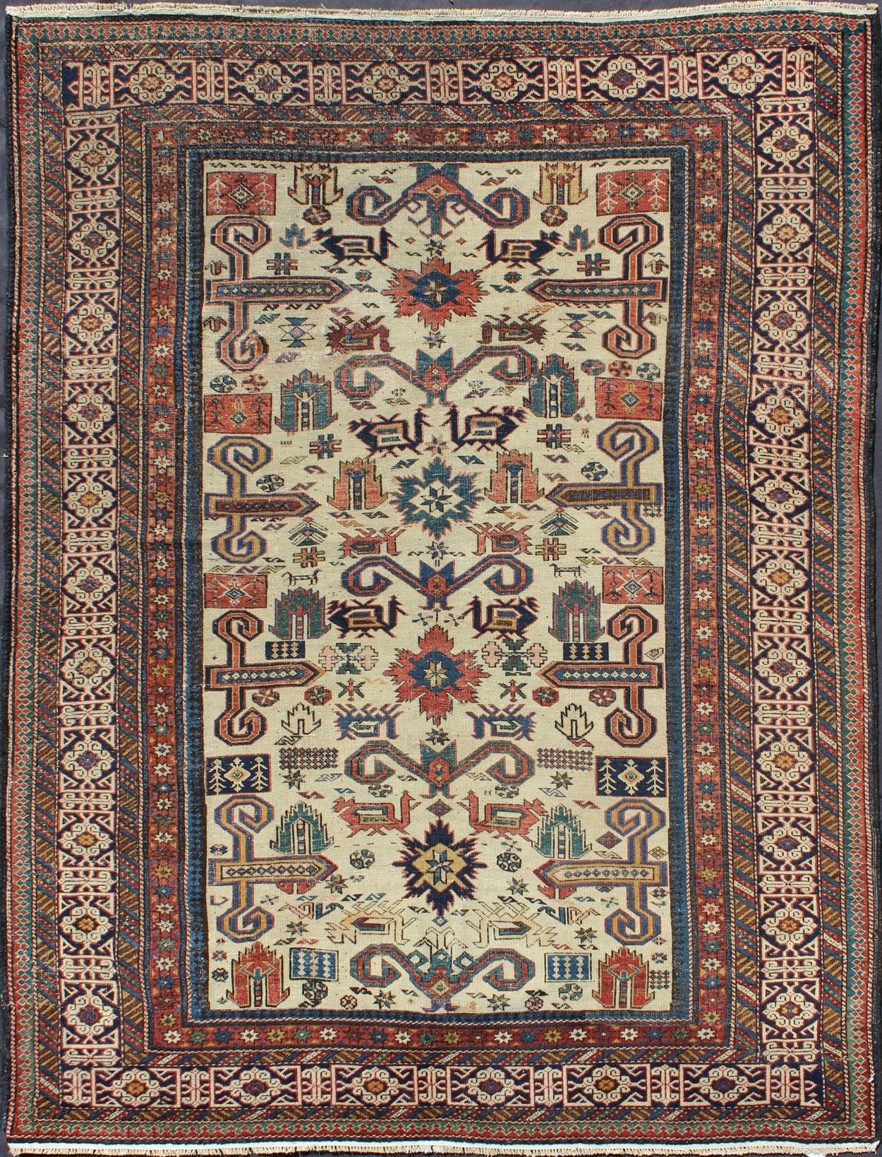 Antique Caucasian Prepedil Rug - This magnificent antique Caucasian Prepedil rug displays a superb Caucasian arabesque accompanied by symbolic devices and protective borders. Crenellated fence guard - bands wind around the perimeter of the field along with... - Keivan Woven ArtsS12 - 0913 - 3674Rug