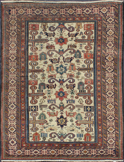 Antique Caucasian Prepedil Rug - This magnificent antique Caucasian Prepedil rug displays a superb Caucasian arabesque accompanied by symbolic devices and protective borders. Crenellated fence guard - bands wind around the perimeter of the field along with... - Keivan Woven ArtsS12 - 0913 - 3674Rug