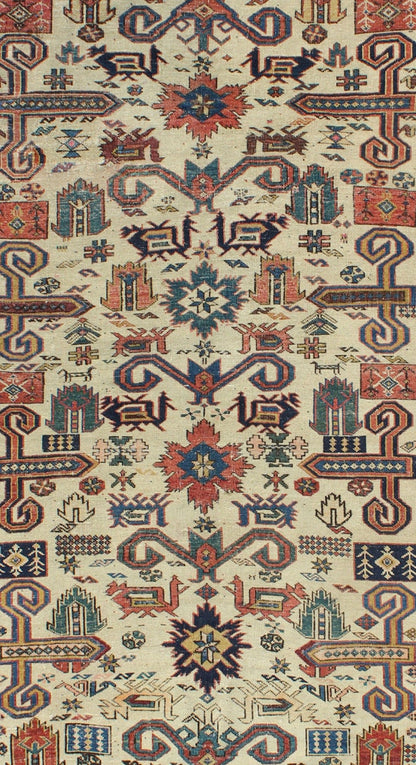 Antique Caucasian Prepedil Rug - This magnificent antique Caucasian Prepedil rug displays a superb Caucasian arabesque accompanied by symbolic devices and protective borders. Crenellated fence guard - bands wind around the perimeter of the field along with... - Keivan Woven ArtsS12 - 0913 - 3674Rug