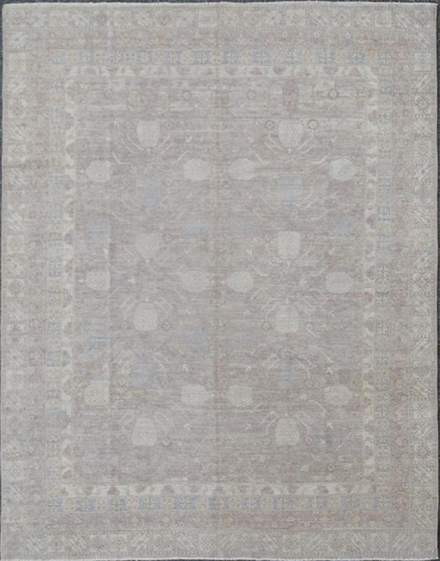 This Khotan features an all - over design flanked by a repeating pattern in the border. The entirety of the piece is rendered in light tones, which makes it a versatile rug, well - suited for a variety of interiors. Colors include light blue, cream and sof... - Keivan Woven ArtsSK - 1319 - 5201Rug